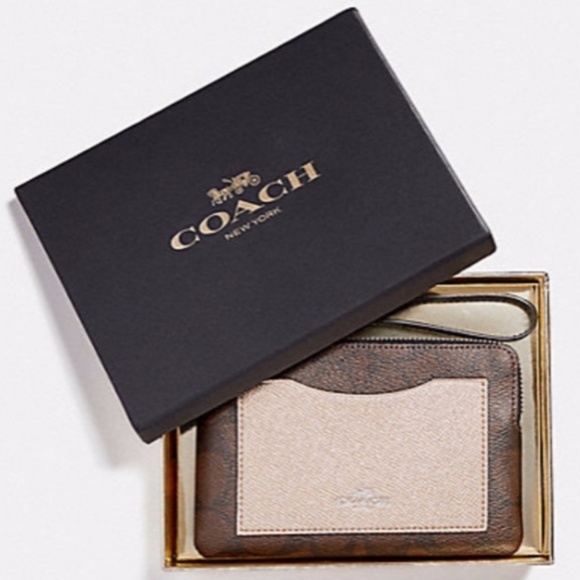 Coach Handbags - NWT Authentic Coach zip wristlet with Coach gift box